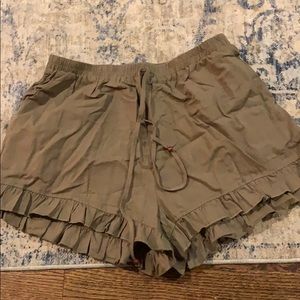 Olive green shorts with ruffle bottom detail